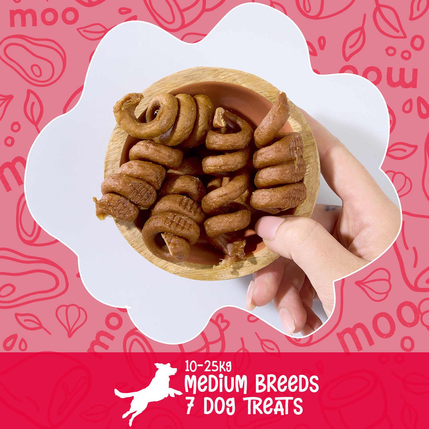 Hand holding a wooden bowl of POW Beefy Tails dog treats with a pink background and 'moo' branding. Text explaining for medium breeds between 10 - 25kg